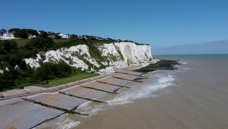 4k drone video of white cliffs with the sunny blue sky