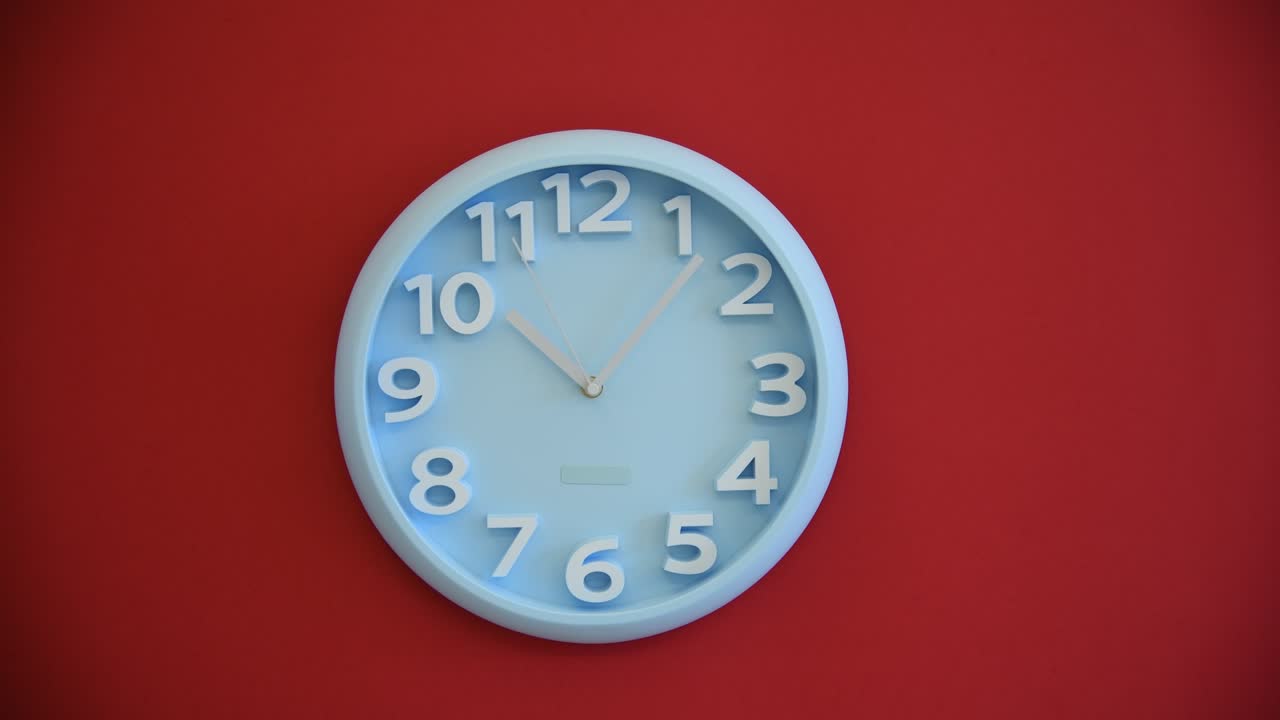 Blue wall clock on red background