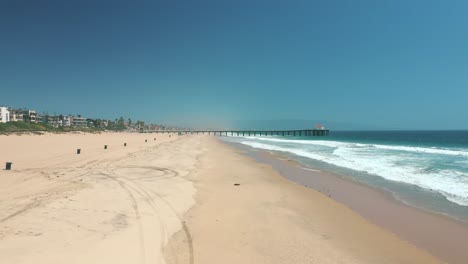 manhattan beach and pier in california, usa - aerial drone shot