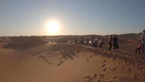 tourists taking pictures in desert, exotic vacation, safari trip