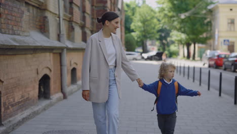 mother and child walking to school