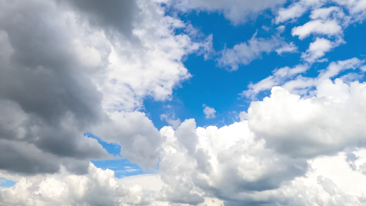 Heavenly beautiful turquoise skies with fluffy clouds quickly transforming in the wind. Spindrift clouds at backdrop. Timelapse.