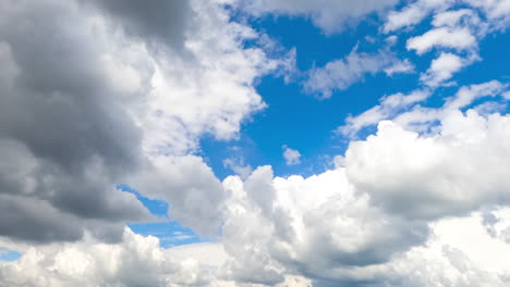 heavenly beautiful turquoise skies with fluffy clouds quickly transforming in the wind. spindrift clouds at backdrop. timelapse.