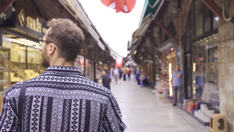 man walking in istanbul spice bazaar.