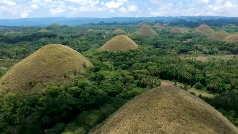 aerial reveal of chocolate hills viewing complex, bohol, philippines