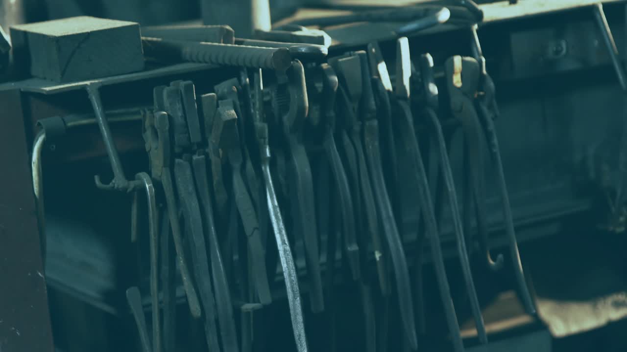 Camera focusing on clamp rack starting overlay pulsing with red waveform tracing numeric labels