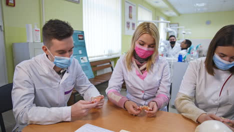 dental students learning and practicing