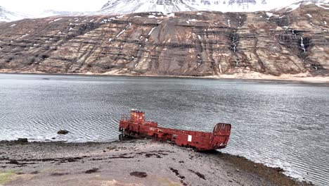 wwii us navy lcm ship wreck in mjoifjordur, iceland - aerial pullback