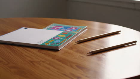 books and pencils on a table