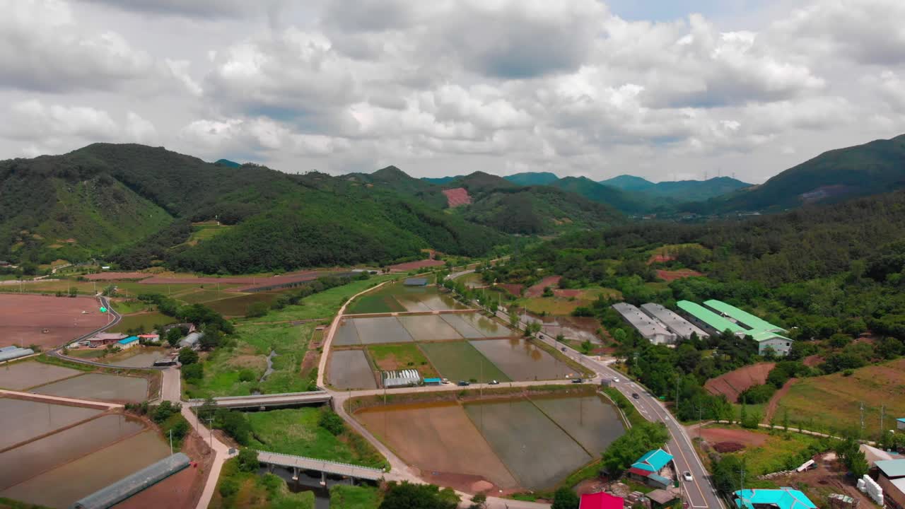 High altitude aerial landscape view and road tracking in country side