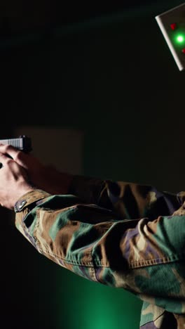 vertical video portrait of joyous gun hobbyist firing lethal fire weapon