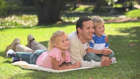young man with his son and his daughter