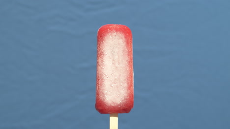 time lapse closeup of an ice pop melting in reverse