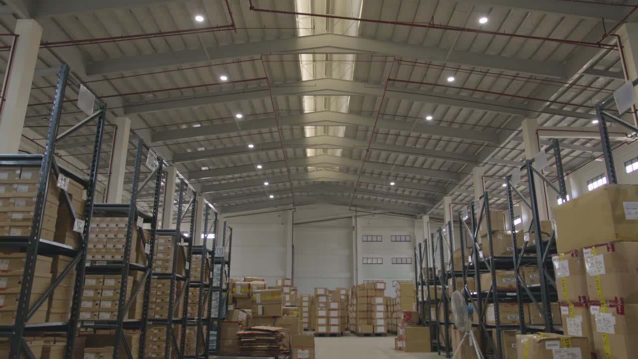 Wide Shot Of Boxes In A Big Warehouse Facility