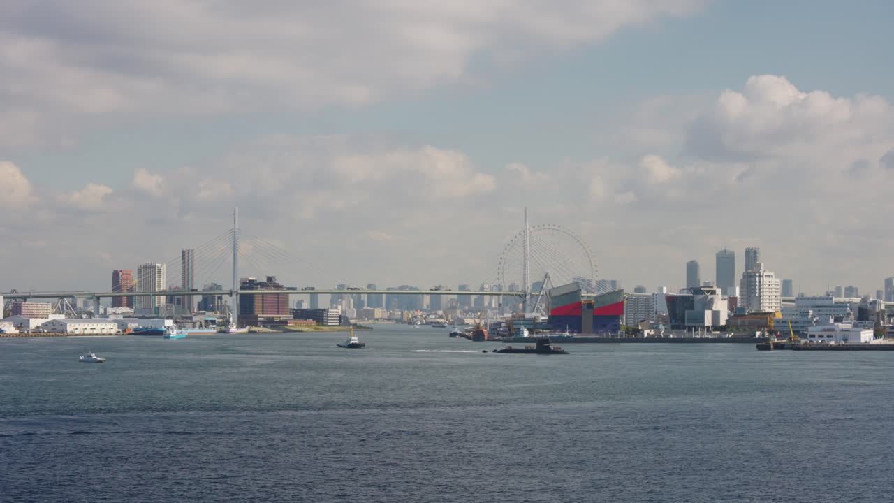 Osaka Bay, City and Aquarium in Background with Boats and Submarine, Japan