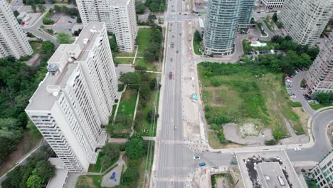 Slow-Overhead-Flyover-of-Busy-Street-in-City