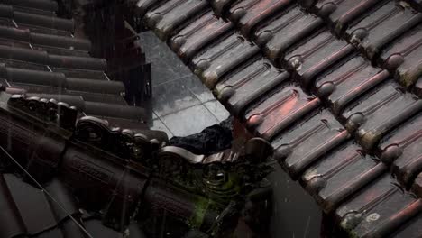 rain pouring on a uniquely designed shingle roof in indonesia