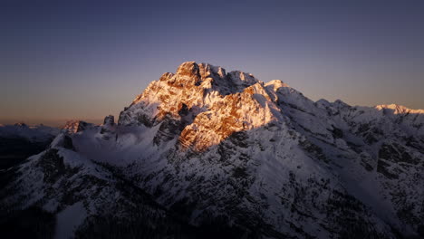 snow-capped mountain peaks at sunrise/sunset