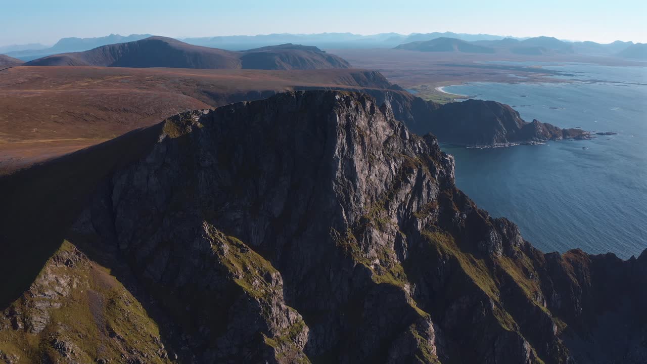 Steep rocky peak of Måtinden mountain overlooking the ocean in northern Norway