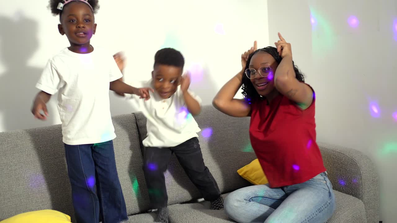 Family having fun dancing together at home