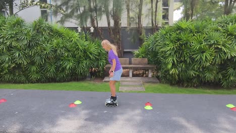 woman rollerblading practice in a park