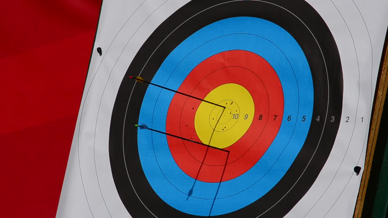 Arrows Hitting a Colorful Archery Target with High Scores