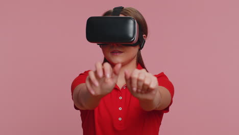 Young-woman-using-virtual-reality-headset-helmet-to-play-simulation-game-app,-watching-video-content