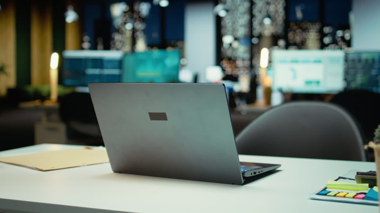 Professional empty office features computers and forecasting equipment