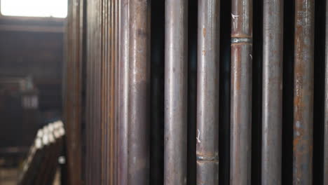 Steel-pipes-with-welding-seams-in-production-factory-storage