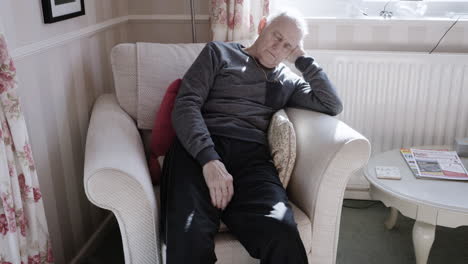 senior man relaxing in living room