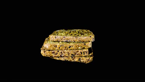 Molds-Growing-On-Slices-Of-Wheat-Bread-With-Sesame-Seeds-In-The-Studio---timelapse