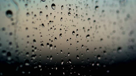 rain drops on glass. texture of rain drops on black background. water droplets on glass. rain drops on the a window pane after the rain. close-up.