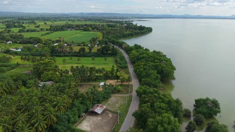 aerial view of rural landscape with lake and road