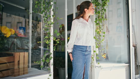 plant shop owner woman open store in spring. beautiful florist work business.