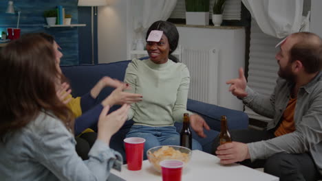 group of multiethnic friends with sticky notes putting on forehead