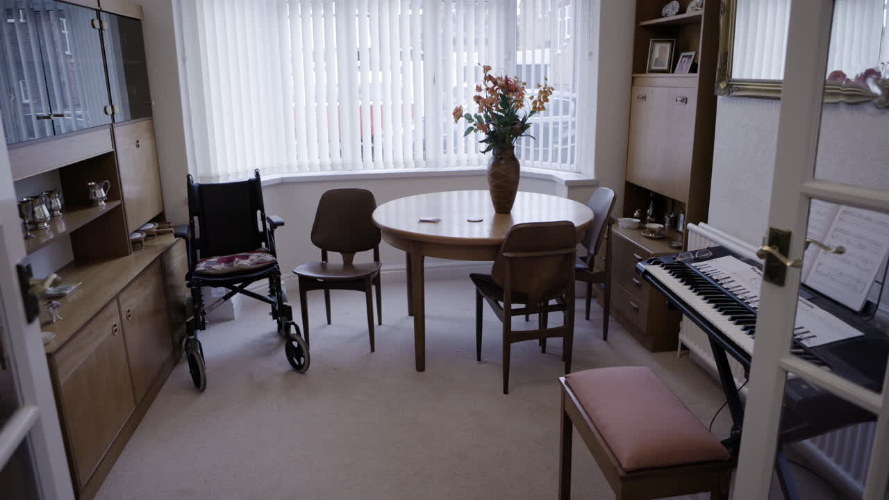 Dining room with wheelchair and piano