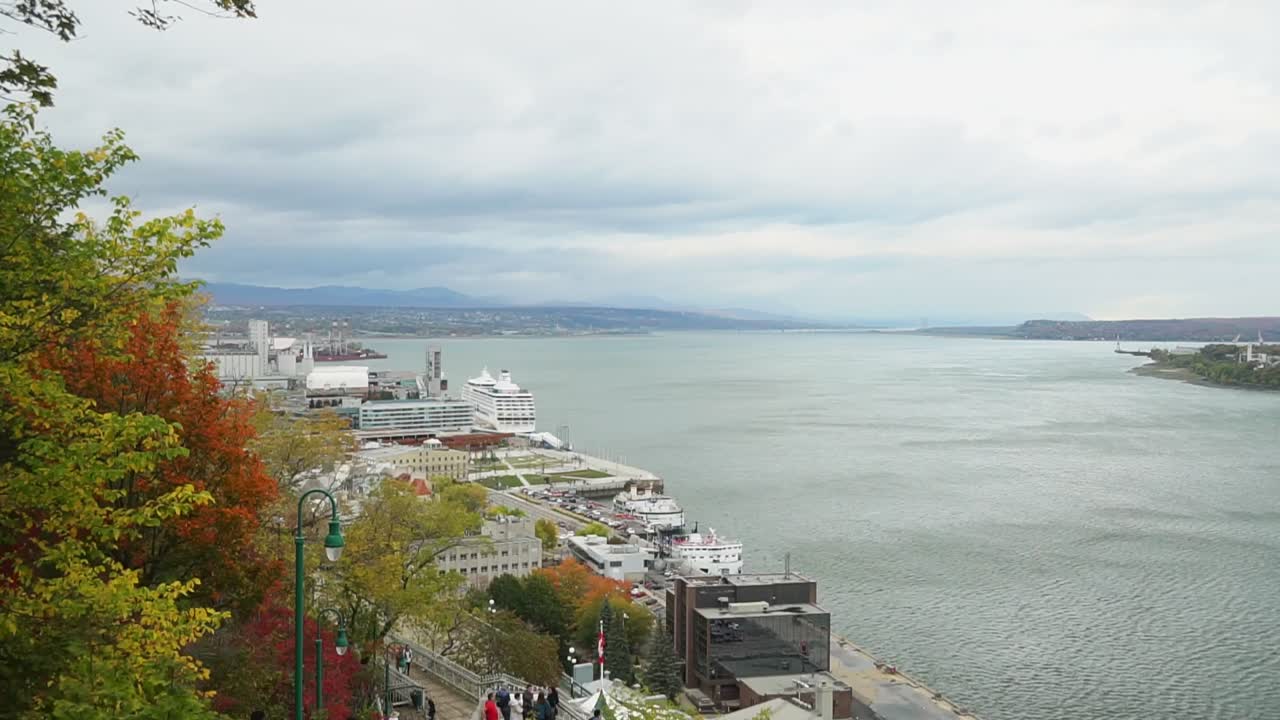 Beautiful harbor view in fall with overcast sky, dark clouds and simmering water