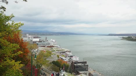 beautiful harbor view in fall with overcast sky, dark clouds and simmering water