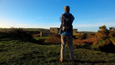 male hiker hiking in countryside 4k