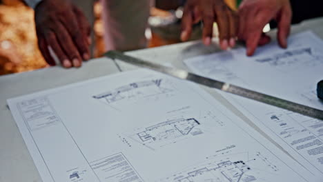 examining architectural blueprints