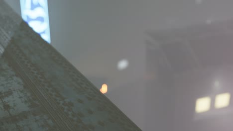 neon lights in soft focus on street with fog at night