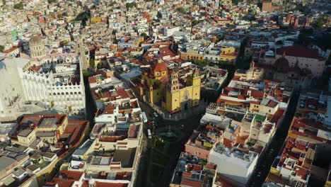 drone descends over guanajuato city center, mexico: famous collegiate basilica of our lady of guanajuato, mexico