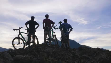 friends enjoying a mountain bike ride at sunrise