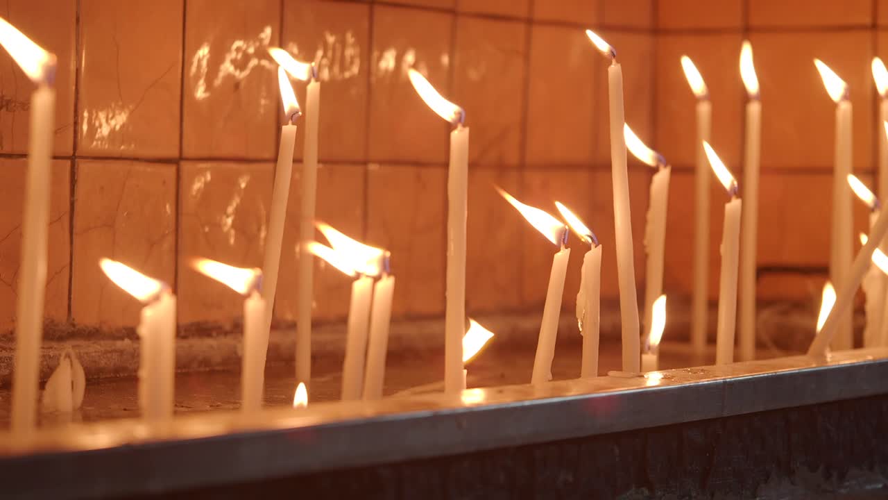 Candles burning in a religious setting