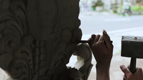 balinese craftsman making stone temple