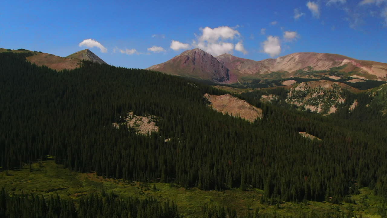 Colorful Colorado cinematic aerial drone summer Boreas Pass Breckenridge Summit County windy green grass dramatic incredible landscape Rocky Mountain peaks daylight circle right motion