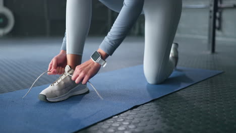 gym woman shoes, shoelaces on floor