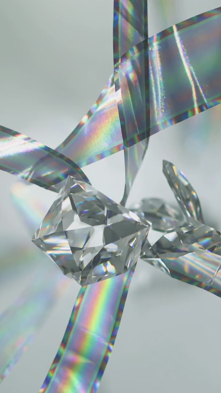 Vertical video: Shifting ribbons lifting square gem revealing fragments and prisms in gray studio