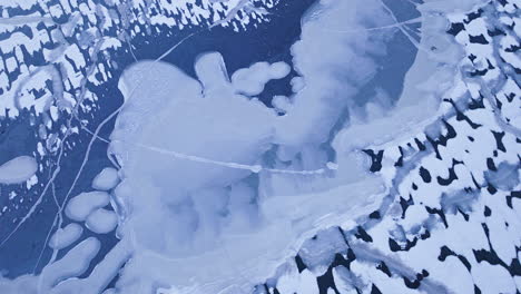 a drone's perspective as it glides over massive ice masses on the water