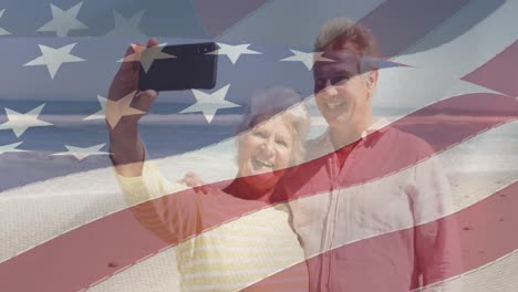 Animation-of-happy-senior-caucasian-couple-taking-selfies-over-flag-of-united-states-of-america